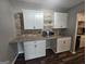 Charming kitchenette offers extra storage with granite counters and a tiled backsplash at 292 Twiggs Cor, Peachtree City, GA 30269