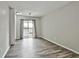Bright living room features hardwood floors and a sliding glass door leading to a balcony at 292 Twiggs Cor, Peachtree City, GA 30269