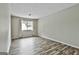 Cozy living room boasting hardwood floors and natural light streaming through the window at 292 Twiggs Cor, Peachtree City, GA 30269