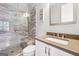 Bathroom with a glass shower and a light wood bench, and a modern countertop at 1685 Tabor Dr, Marietta, GA 30062