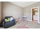 Comfortable bedroom featuring a reading chair, play equipment and carpet floors at 1685 Tabor Dr, Marietta, GA 30062