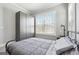 Neutral bedroom featuring a metal frame bed, carpeted floors and custom wardrobe at 1685 Tabor Dr, Marietta, GA 30062