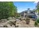 Expansive backyard featuring a fire pit, custom pool, lush landscaping and gazebo at 4030 River Ridge Chase Se, Marietta, GA 30067