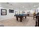 Finished basement with pool table, entertainment area, wet bar, and stylish flooring at 4030 River Ridge Chase Se, Marietta, GA 30067