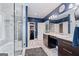 Elegant bathroom featuring a glass shower, vanity with drawers, and an adjoining walk-in closet at 4030 River Ridge Chase Se, Marietta, GA 30067