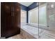 Bright bathroom with a built-in tub, stylish tiling, and a window for natural light at 4030 River Ridge Chase Se, Marietta, GA 30067