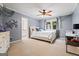 Comfortable bedroom with a ceiling fan, a window with curtains, and carpeted flooring at 4030 River Ridge Chase Se, Marietta, GA 30067