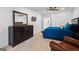 Bedroom with a TV, wood floors, and a large dresser for storage and entertainment at 4030 River Ridge Chase Se, Marietta, GA 30067