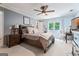 Well-lit bedroom with a large window, neutral paint, plush bedding, and wood furniture at 4030 River Ridge Chase Se, Marietta, GA 30067