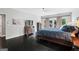 Comfortable bedroom with hardwood floors, French doors, and dresser providing ample storage at 4030 River Ridge Chase Se, Marietta, GA 30067