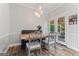 Cozy dining area with stylish chairs, bench seating, and a glass door leading to an outdoor space at 4030 River Ridge Chase Se, Marietta, GA 30067