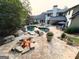 Beautiful backyard featuring a fire pit, lush landscaping, pool and gazebo at 4030 River Ridge Chase Se, Marietta, GA 30067