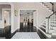 Elegant foyer with hardwood floors, staircase, and entry to living spaces at 4030 River Ridge Chase Se, Marietta, GA 30067