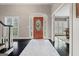 Inviting foyer with hardwood floors, decorative rug, and arched doorway to a dining space at 4030 River Ridge Chase Se, Marietta, GA 30067