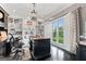 Comfortable home office featuring custom built-in shelving, a large desk and nice window light at 4030 River Ridge Chase Se, Marietta, GA 30067