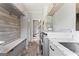 Convenient laundry room with custom cabinets, sink, bench, and storage space with modern appliances at 4030 River Ridge Chase Se, Marietta, GA 30067