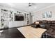 Living room featuring built in shelving, recessed lighting, hardwood floors, area rug and comfortable furniture at 4030 River Ridge Chase Se, Marietta, GA 30067