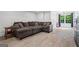 Living area with an oversized sectional, offering a cozy space for relaxation and entertainment at 4030 River Ridge Chase Se, Marietta, GA 30067