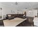 Expansive living room featuring dark hardwood floors, recessed lighting and comfortable seating arrangement at 4030 River Ridge Chase Se, Marietta, GA 30067