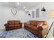 Basement living room featuring hardwood floors and a blue area rug at 4030 River Ridge Chase Se, Marietta, GA 30067