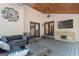 Outdoor patio featuring comfortable seating, mounted television, and elegant ceiling fans at 4030 River Ridge Chase Se, Marietta, GA 30067