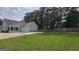Spacious backyard with lush green lawn and mature trees at 100 Rabbits Run, Fayetteville, GA 30214