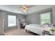 Bright bedroom with natural light, ceiling fan, and a dedicated workspace for studying at 100 Rabbits Run, Fayetteville, GA 30214