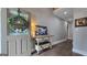 Welcoming foyer with wood floors and a charming accent table at 100 Rabbits Run, Fayetteville, GA 30214