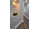 Inviting hallway niche with charming decor and wood-look flooring at 100 Rabbits Run, Fayetteville, GA 30214