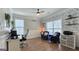 Comfortable home office space with ample lighting, wood floors, and tasteful decor at 100 Rabbits Run, Fayetteville, GA 30214