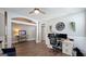 Comfortable home office space with ample lighting, wood floors, and tasteful decor at 100 Rabbits Run, Fayetteville, GA 30214