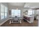 The kitchen features white cabinets, stainless appliances, a kitchen island, and a dining table at 100 Rabbits Run, Fayetteville, GA 30214