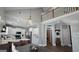 The kitchen features white cabinets, stainless appliances, a kitchen island, and a dining table at 100 Rabbits Run, Fayetteville, GA 30214