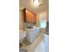 Functional laundry room with a washer, dryer, utility sink, cabinets, and a window for a bright and convenient space at 100 Rabbits Run, Fayetteville, GA 30214