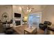 Spacious living room features fireplace, vaulted ceiling, and open staircase at 100 Rabbits Run, Fayetteville, GA 30214