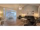 Comfortable living room offers ample seating, a ceiling fan, and plenty of natural light at 100 Rabbits Run, Fayetteville, GA 30214