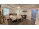 Inviting primary bedroom with tray ceiling, ceiling fan, and natural light at 100 Rabbits Run, Fayetteville, GA 30214
