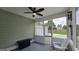 Relaxing screened porch featuring a ceiling fan, and views of the backyard at 100 Rabbits Run, Fayetteville, GA 30214