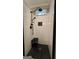Modern shower features white subway tile, black fixtures, and black mosaic tile flooring at 100 Rabbits Run, Fayetteville, GA 30214