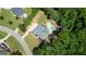 Overhead view of home and private pool surrounded by well-manicured lawn and wooded area, highlighting property's privacy at 265 Beverly Farms Dr, Sharpsburg, GA 30277