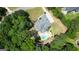 An aerial view of a beautiful home with a private pool and lush landscaping at 265 Beverly Farms Dr, Sharpsburg, GA 30277