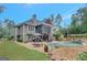 Expansive backyard with a screened porch, patio, and stunning in-ground pool area at 265 Beverly Farms Dr, Sharpsburg, GA 30277