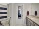 Bathroom with tile floors, neutral walls, single vanity with solid surface countertop, and shower tub combo at 265 Beverly Farms Dr, Sharpsburg, GA 30277