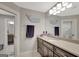 Bathroom with a vanity, large mirror, modern lighting, and whale decorations at 265 Beverly Farms Dr, Sharpsburg, GA 30277