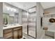 Modern bathroom with white vanity, large glass shower, and built-in bench with wall decor at 265 Beverly Farms Dr, Sharpsburg, GA 30277