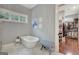 Bathroom features a standalone tub, beautiful light fixtures, and a large walk-in closet at 265 Beverly Farms Dr, Sharpsburg, GA 30277