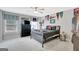Spacious bedroom with a ceiling fan, large window, and tasteful sports decor at 265 Beverly Farms Dr, Sharpsburg, GA 30277