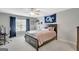 Bedroom with carpet, ceiling fan, dark trim and a window with natural light at 265 Beverly Farms Dr, Sharpsburg, GA 30277