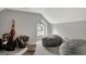 Bonus room featuring cozy seating, a quirky window, and neutral paint colors at 265 Beverly Farms Dr, Sharpsburg, GA 30277