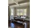 Cozy dining area featuring built-in benches, natural light, and modern light fixture at 265 Beverly Farms Dr, Sharpsburg, GA 30277
